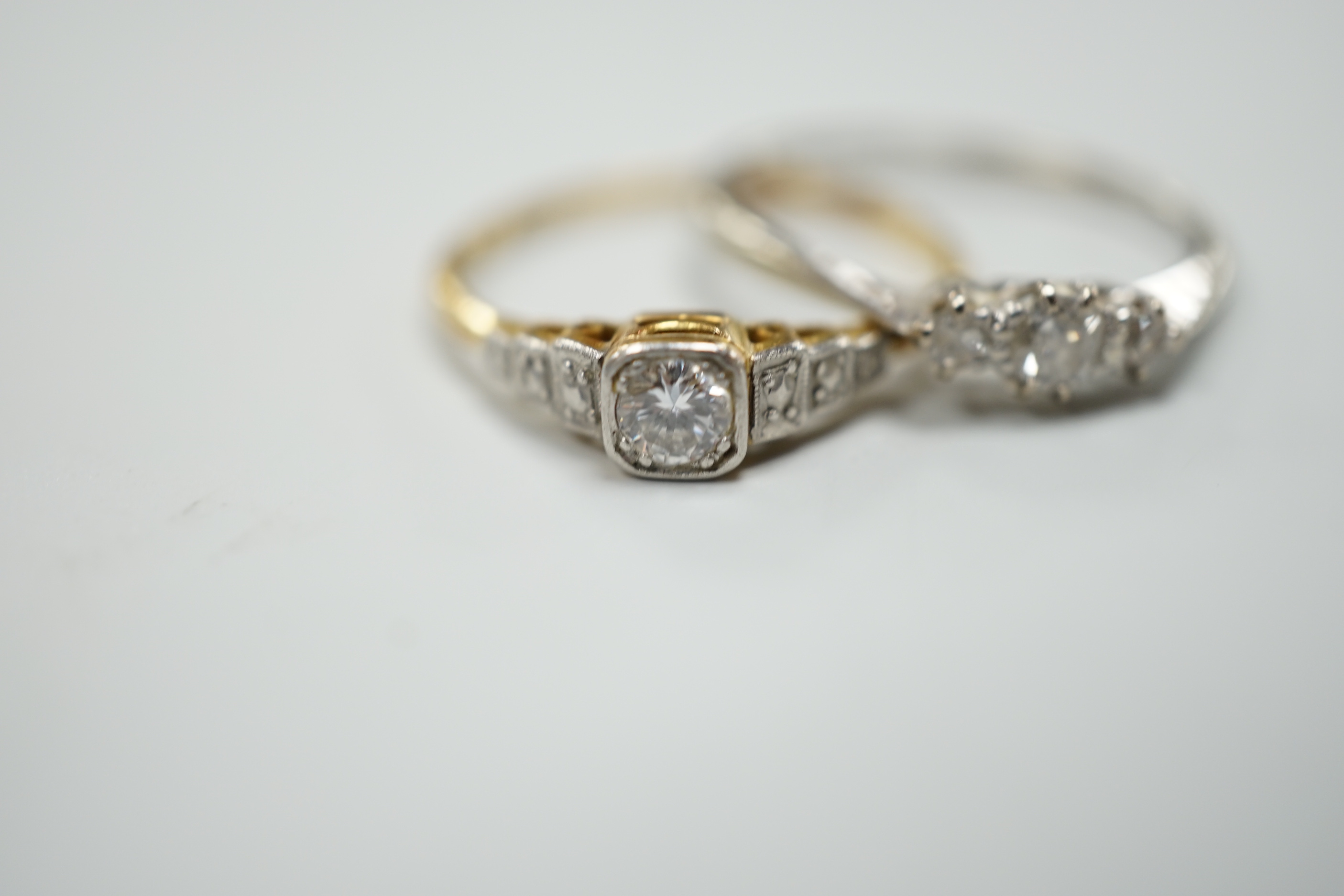 Two 18ct,plat and diamond set rings including single stone, size Q and three stone, size O/P, gross weight 4.3 grams.